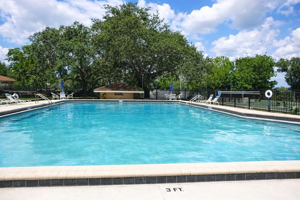 672 Post Oak Circle, Unit 106 Altamonte Springs, FL 32701 - Photo 11 of 21 a view of a swimming pool with a yard