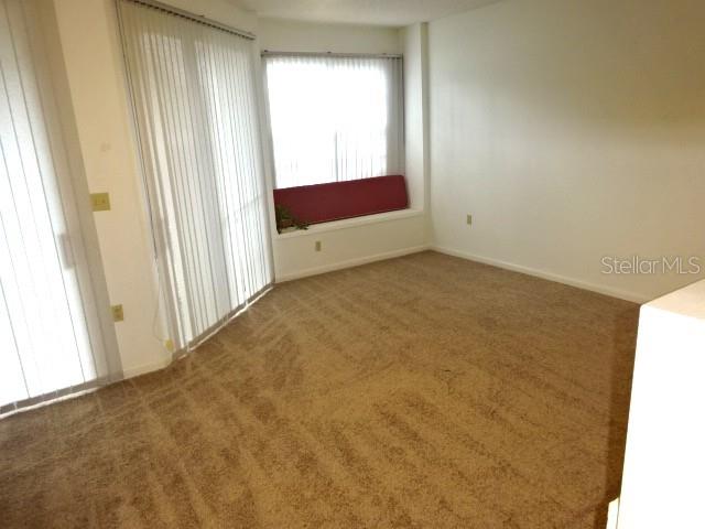 672 Post Oak Circle, Unit 106 Altamonte Springs, FL 32701 - Photo 14 of 21 a view of an empty room and window