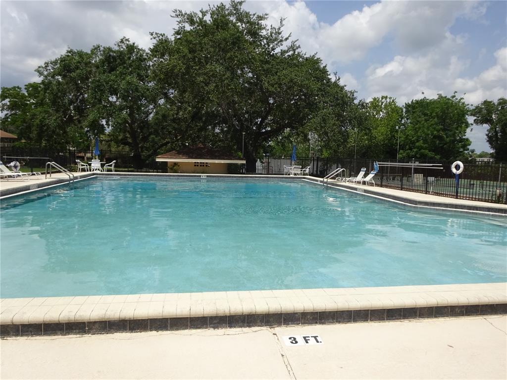672 Post Oak Circle, Unit 106 Altamonte Springs, FL 32701 - Photo 16 of 21 a view of swimming pool with a yard
