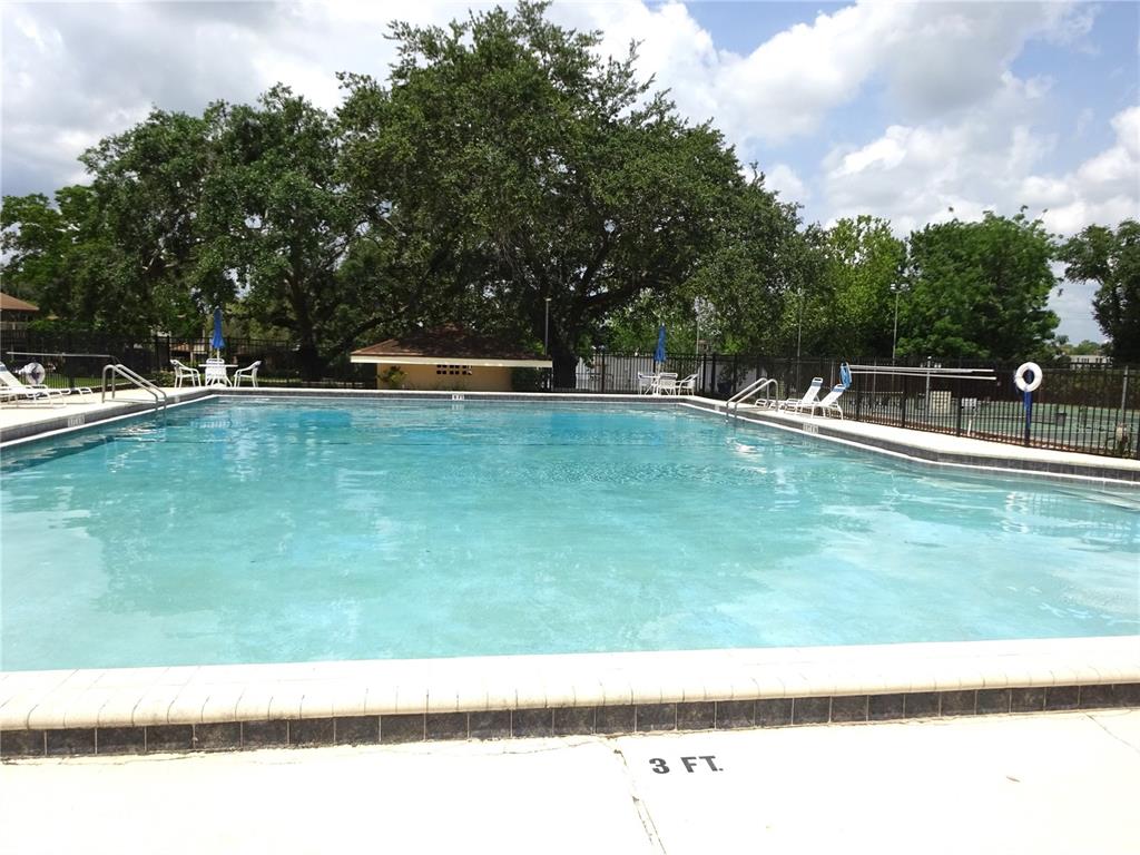 672 Post Oak Circle, Unit 106 Altamonte Springs, FL 32701 - Photo 17 of 21 a view of swimming pool with a yard
