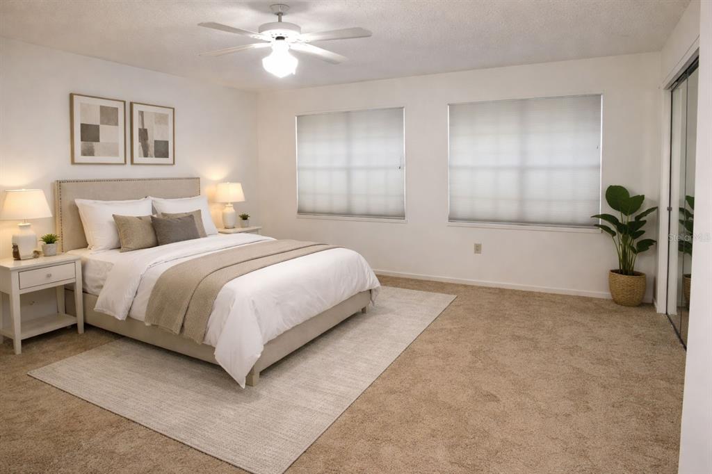 672 Post Oak Circle, Unit 106 Altamonte Springs, FL 32701 - Photo 7 of 21 a bedroom with a bed and a chandelier
