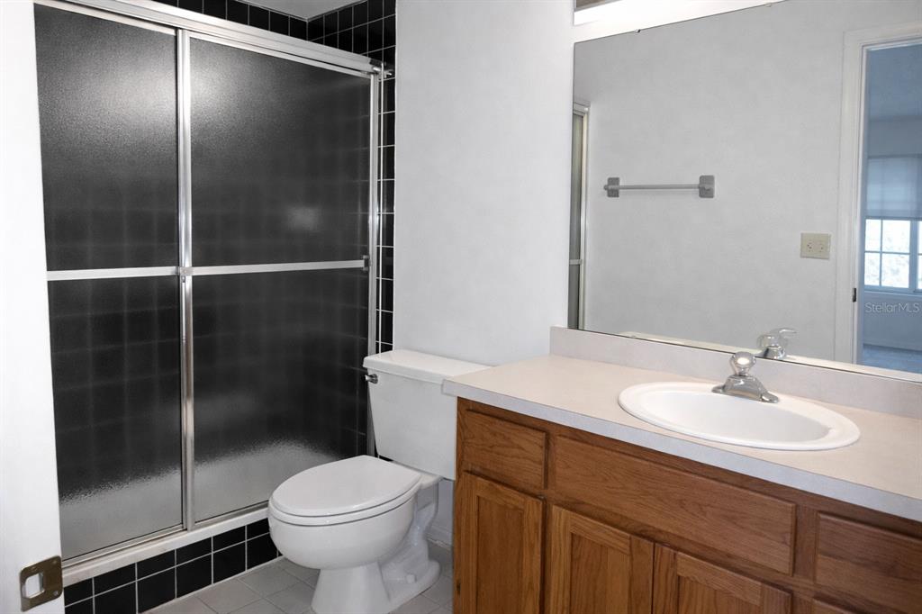 672 Post Oak Circle, Unit 106 Altamonte Springs, FL 32701 - Photo 8 of 21 a bathroom with a sink toilet and shower