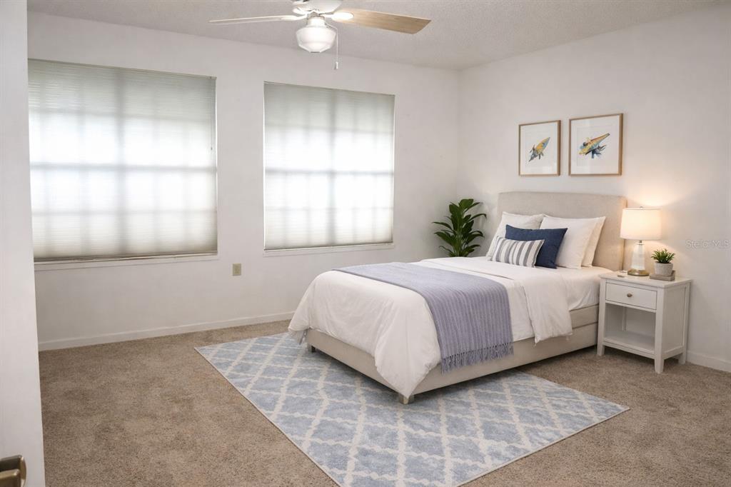 672 Post Oak Circle, Unit 106 Altamonte Springs, FL 32701 - Photo 9 of 21 a bedroom with a bed and a window