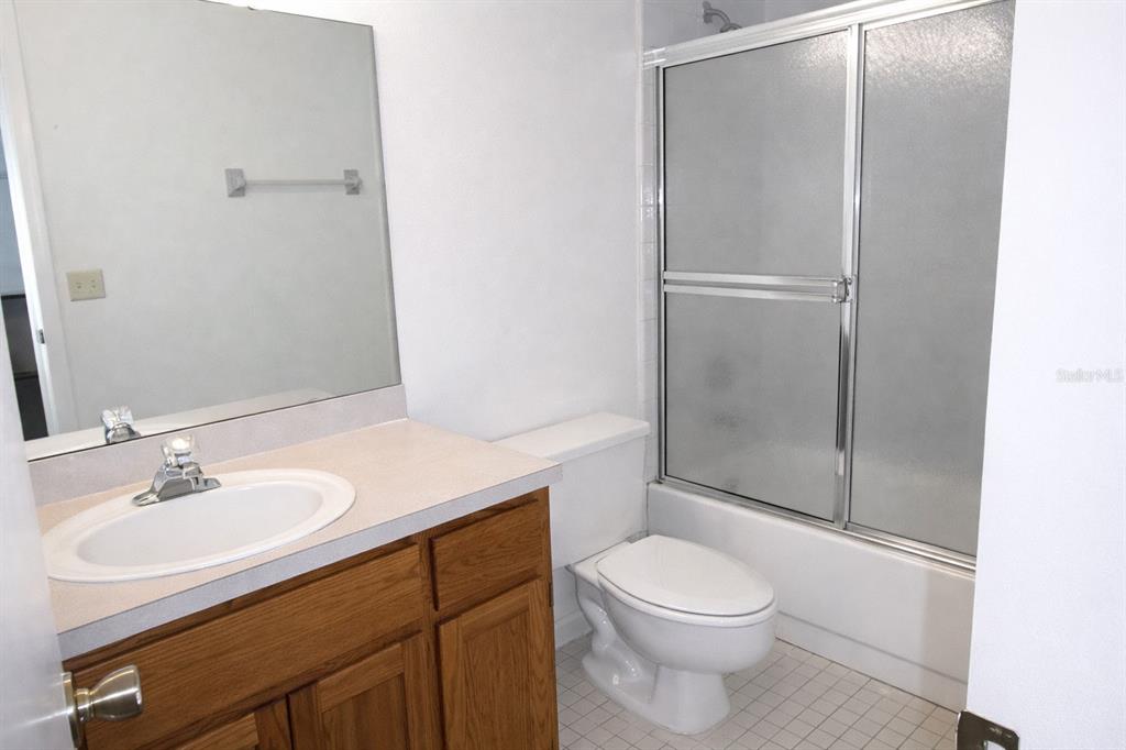 672 Post Oak Circle, Unit 106 Altamonte Springs, FL 32701 - Photo 10 of 21 a bathroom with a sink a toilet and shower