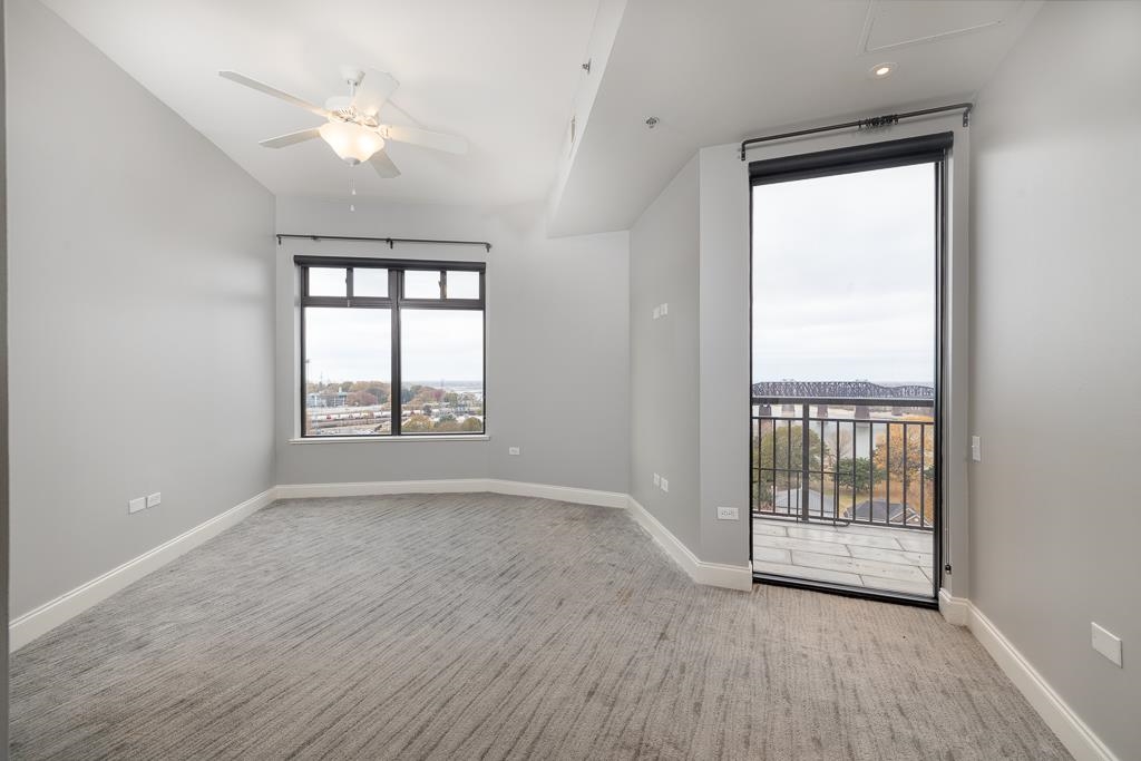 717 Riverside Drive, Unit 1105 Memphis, TN 38103 - Photo 13 of 29 Unfurnished room featuring light colored carpet and a ceiling fan