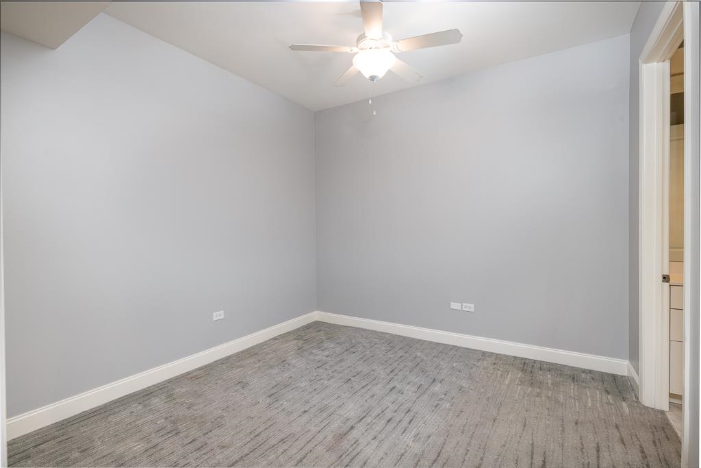 717 Riverside Drive, Unit 1105 Memphis, TN 38103 - Photo 18 of 29 Spare room featuring a ceiling fan and light wood-style flooring