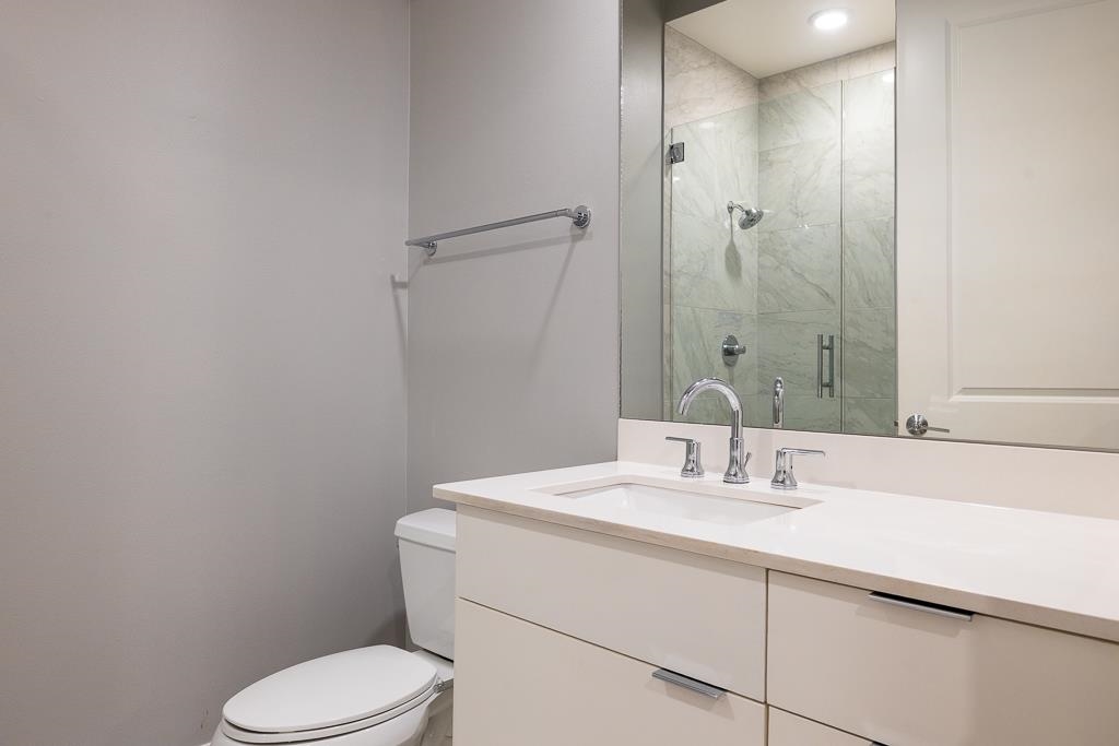 717 Riverside Drive, Unit 1105 Memphis, TN 38103 - Photo 21 of 29 Full bath with vanity and a shower stall