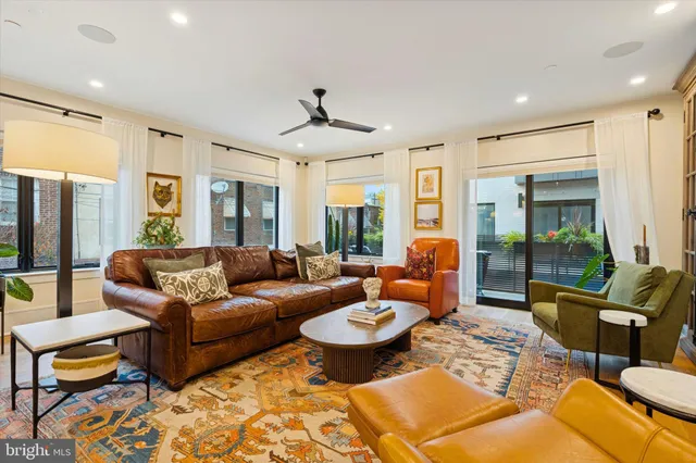 a bathroom with a toilet a sink and a mirror