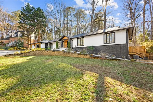 a view of a house with a yard