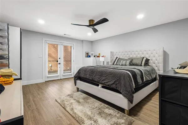a bedroom with a large bed and a large window