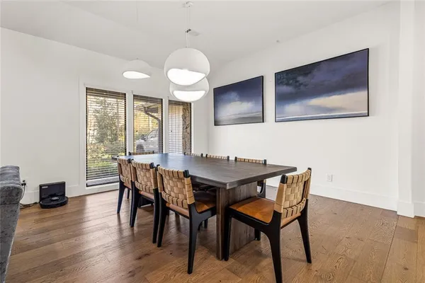 a view of a dining room with furniture and wooden floor