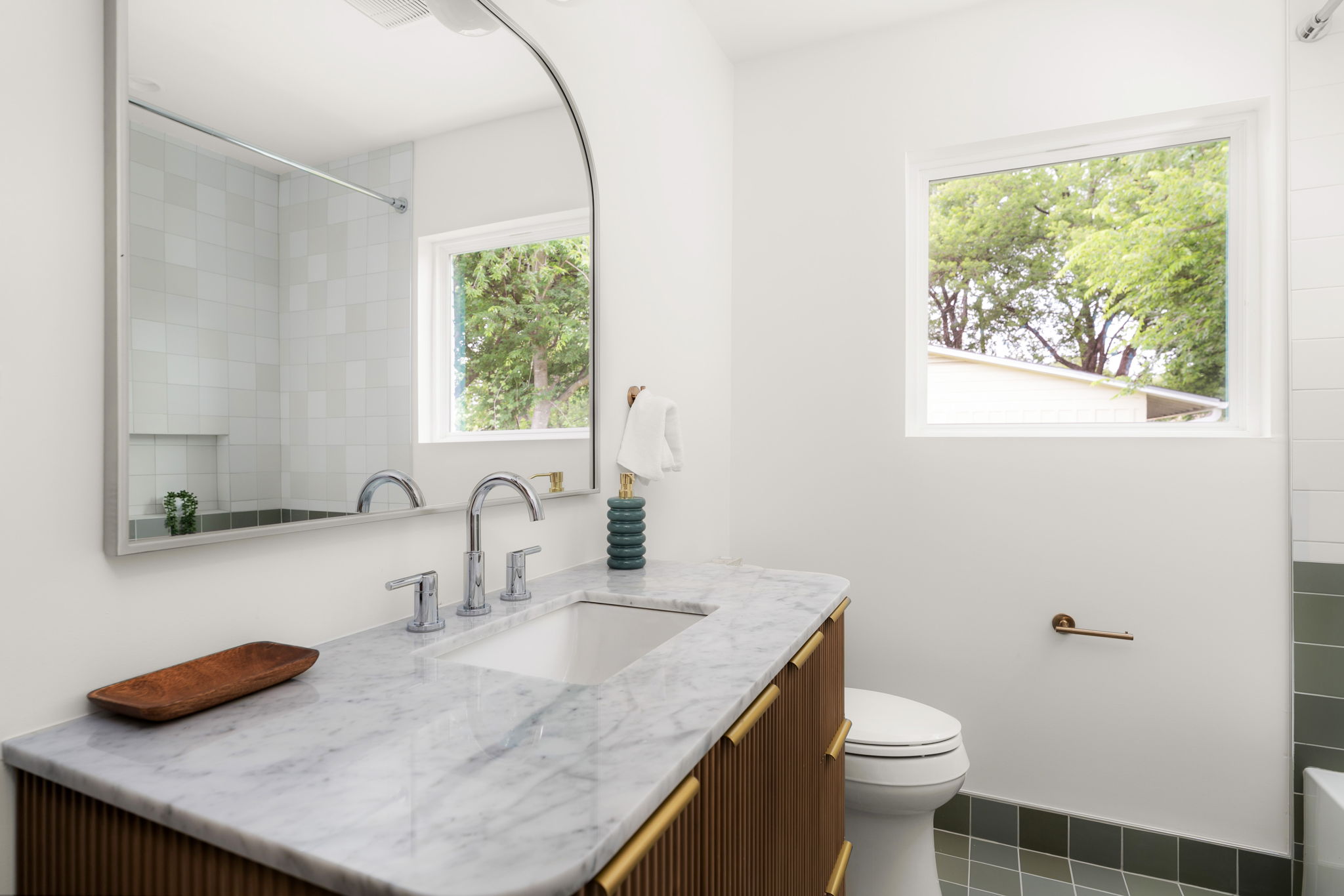 4902 Blueberry Trail, Unit 1 Austin, TX 78723 - Photo 22 of 30 a bathroom with a granite countertop sink and a toilet