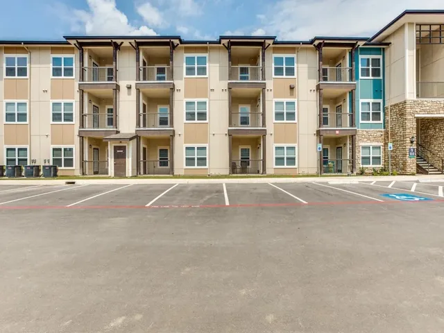 a front view of a building with a street