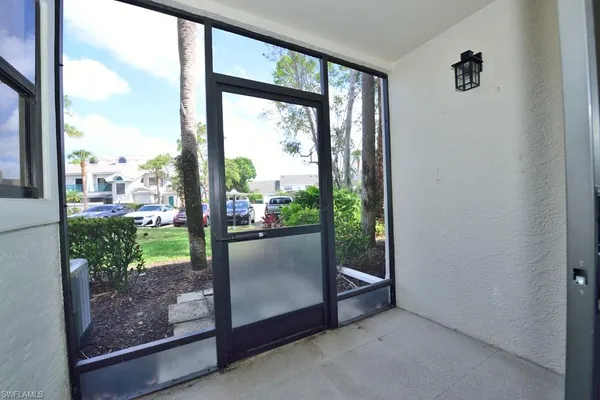 a view of a glass door and porch