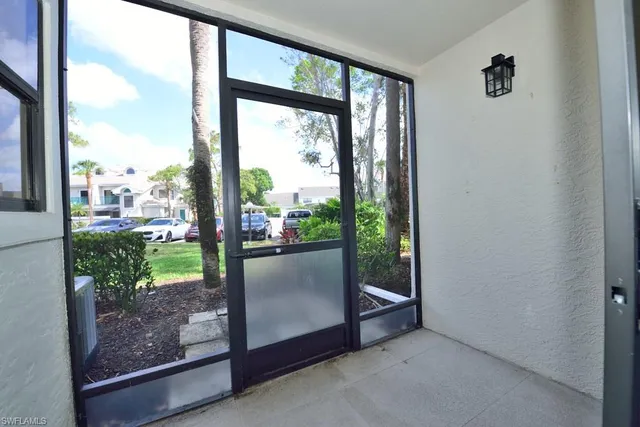 a view of a glass door and porch