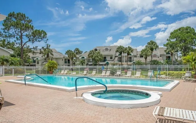 a view of a swimming pool with a patio