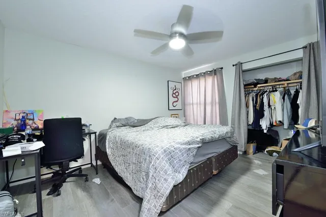 a bed room with a bed and furniture