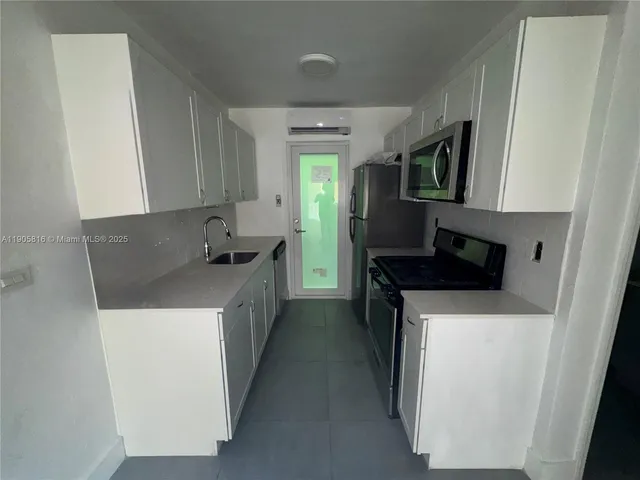 a bathroom with a toilet sink and shower