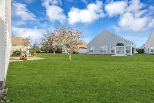a view of a house with a big yard
