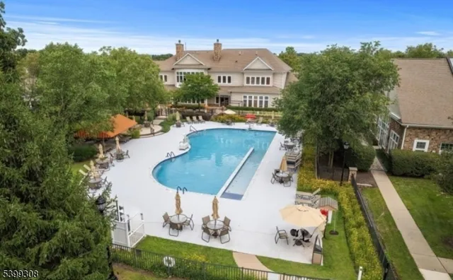 a view of a swimming pool with a patio