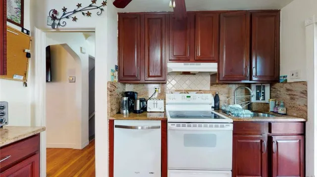 a kitchen with stainless steel appliances granite countertop a refrigerator sink and cabinets
