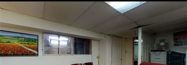 a view of entryway with a floor to ceiling window