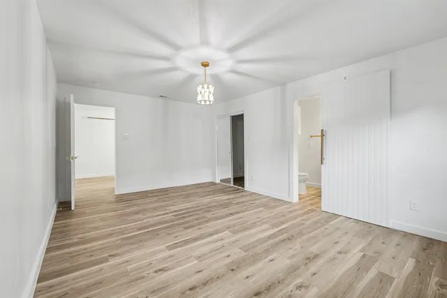 a kitchen with stainless steel appliances granite countertop a sink a stove and a window