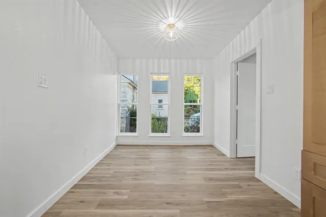 a kitchen with a sink and wooden cabinets