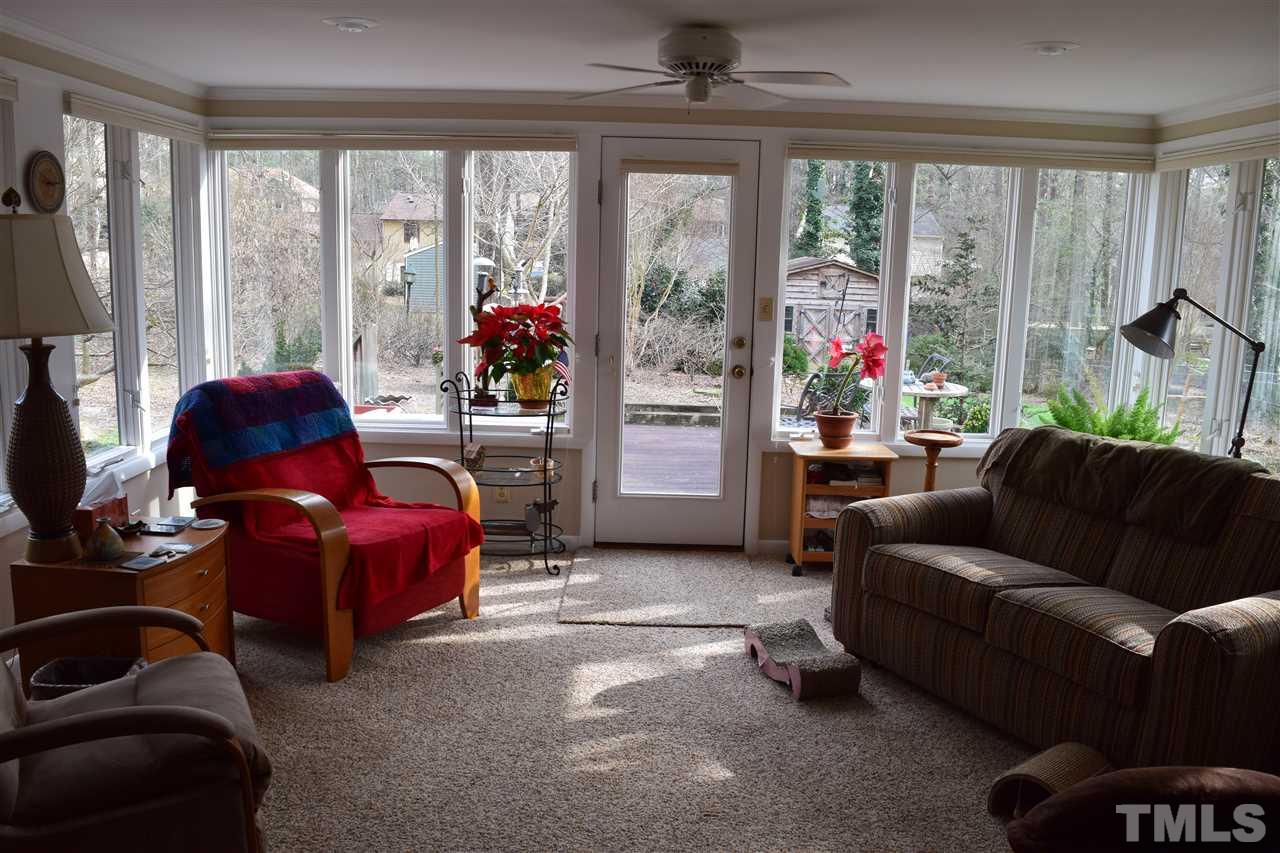 6908 Justice Drive Raleigh, NC 27615 - Photo 13 of 15 Great sun room that over looks the back yard and open to family room