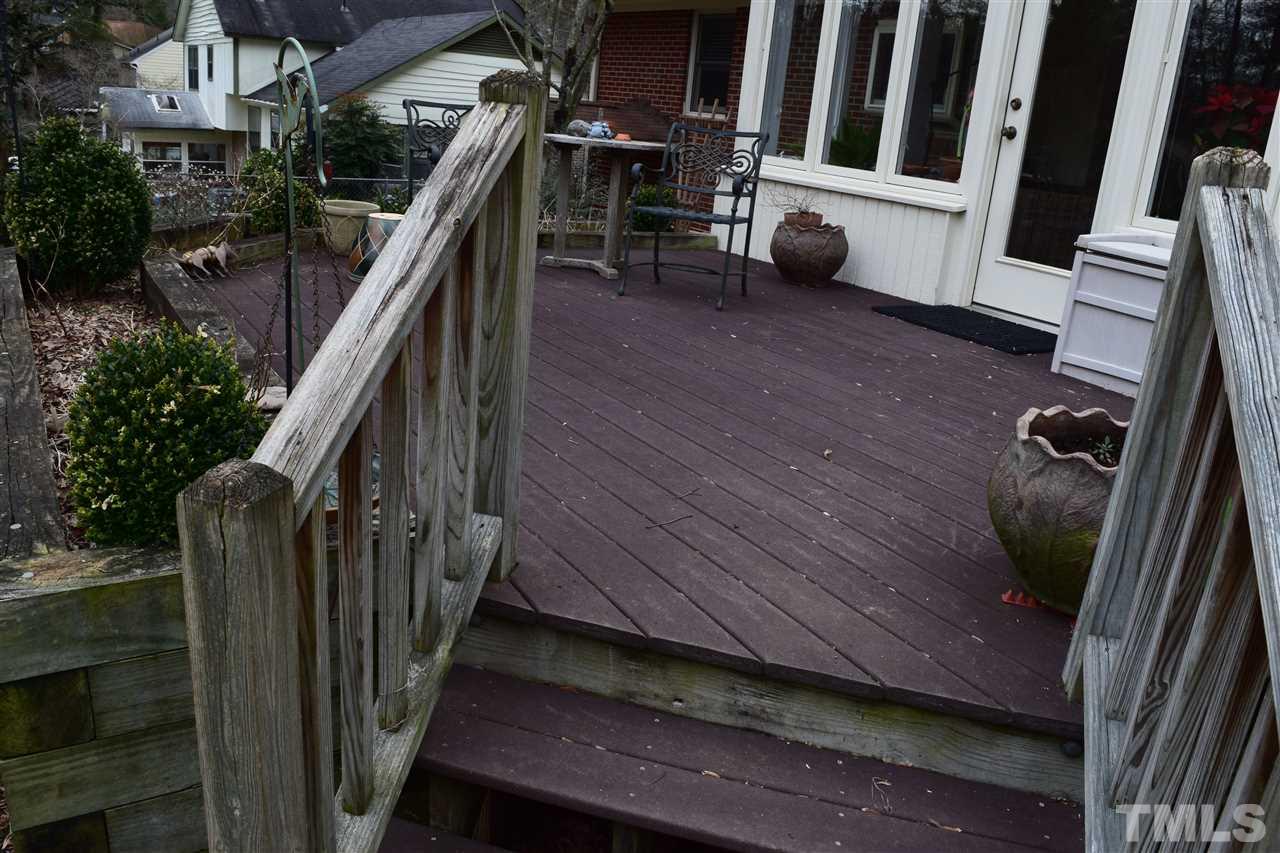 6908 Justice Drive Raleigh, NC 27615 - Photo 4 of 15 Deck with Trex type flooring and flower bed.