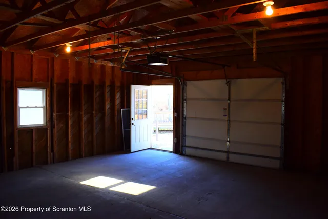 a view of walk in closet with clothes