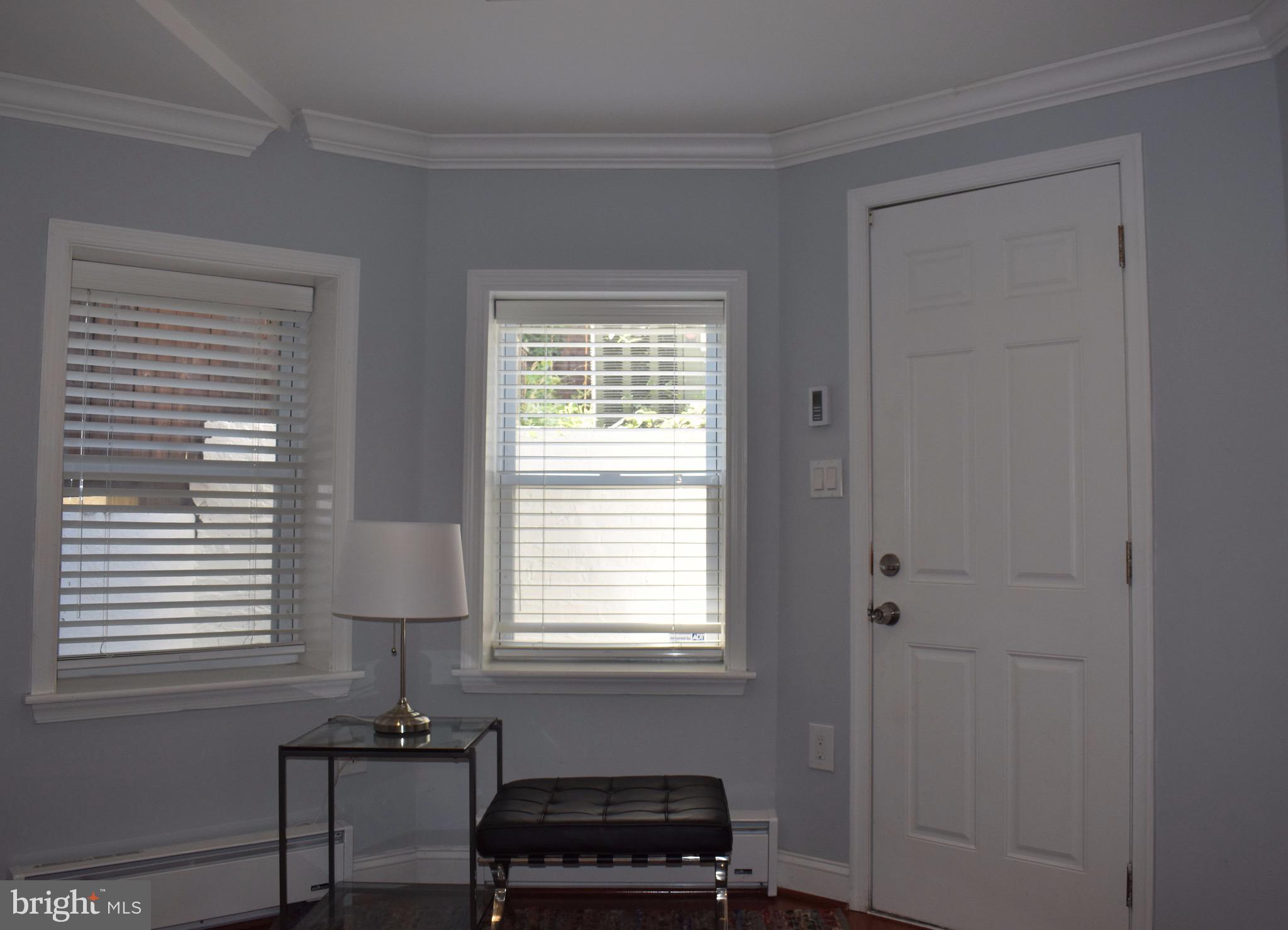 22 N Street Northwest, Unit B Washington, DC 20001 - Photo 11 of 15 a bedroom with a window and a chair