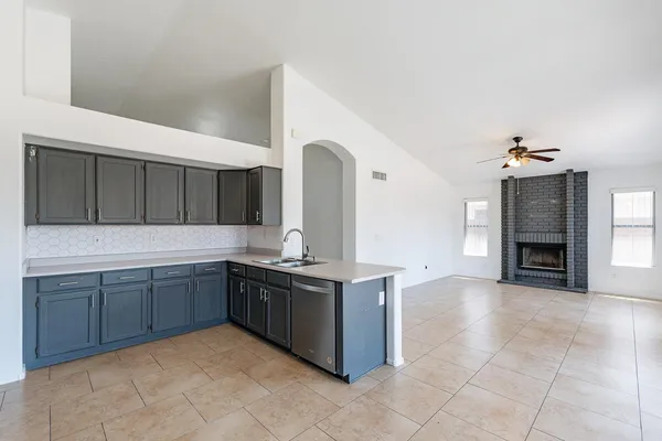 a kitchen with stainless steel appliances granite countertop a sink and cabinets