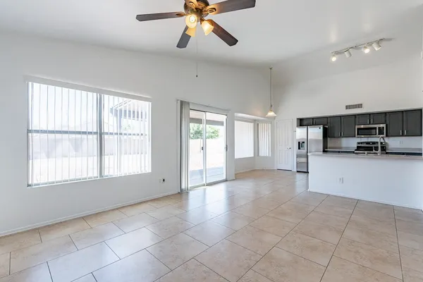 a view of a kitchen with furniture and windows