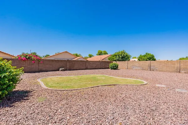 a view of a swimming pool with a backyard