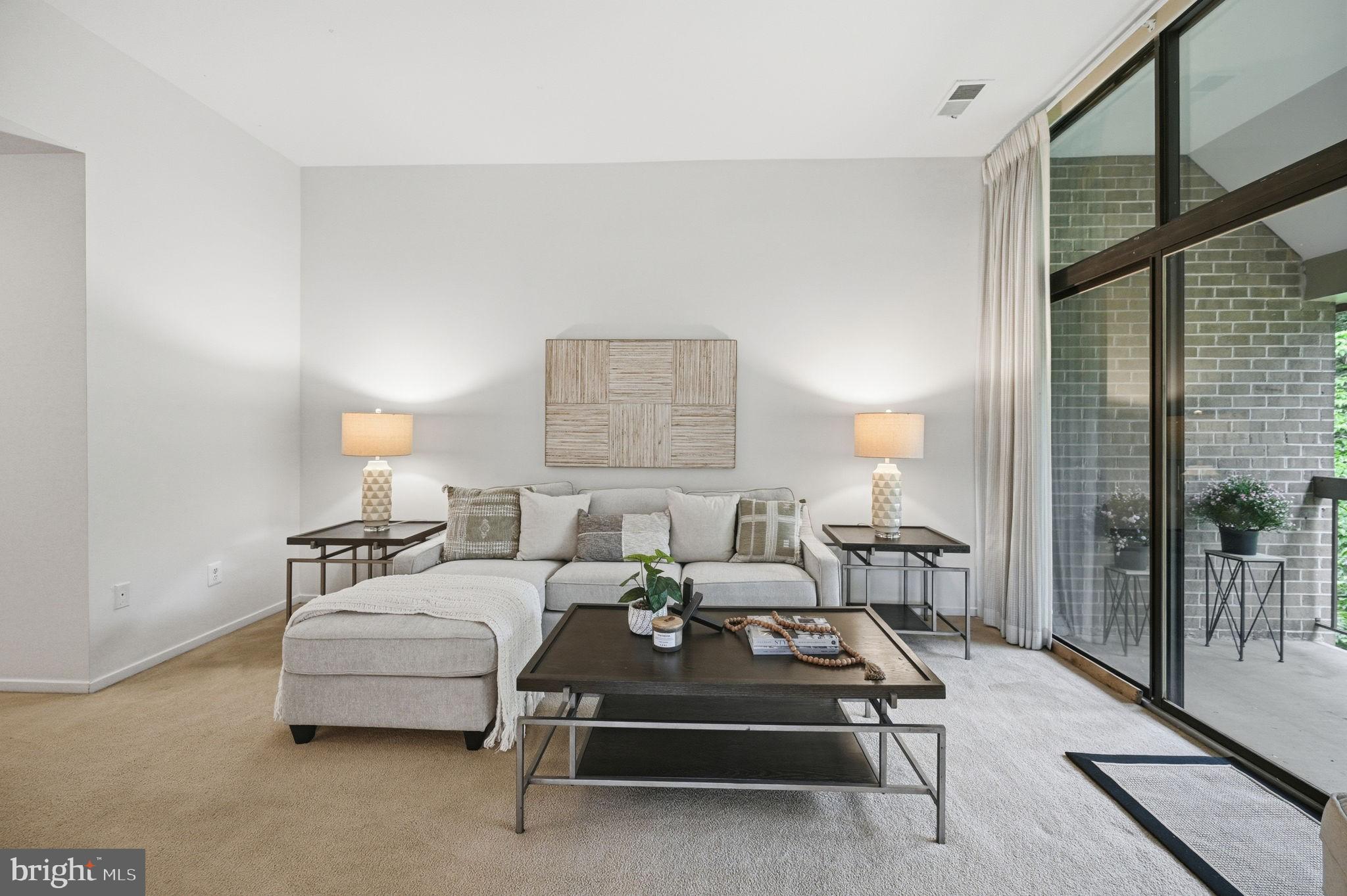 1659 Parkcrest Circle, Unit C Reston, VA 20190 - Photo 12 of 31 a living room with furniture and a lamp