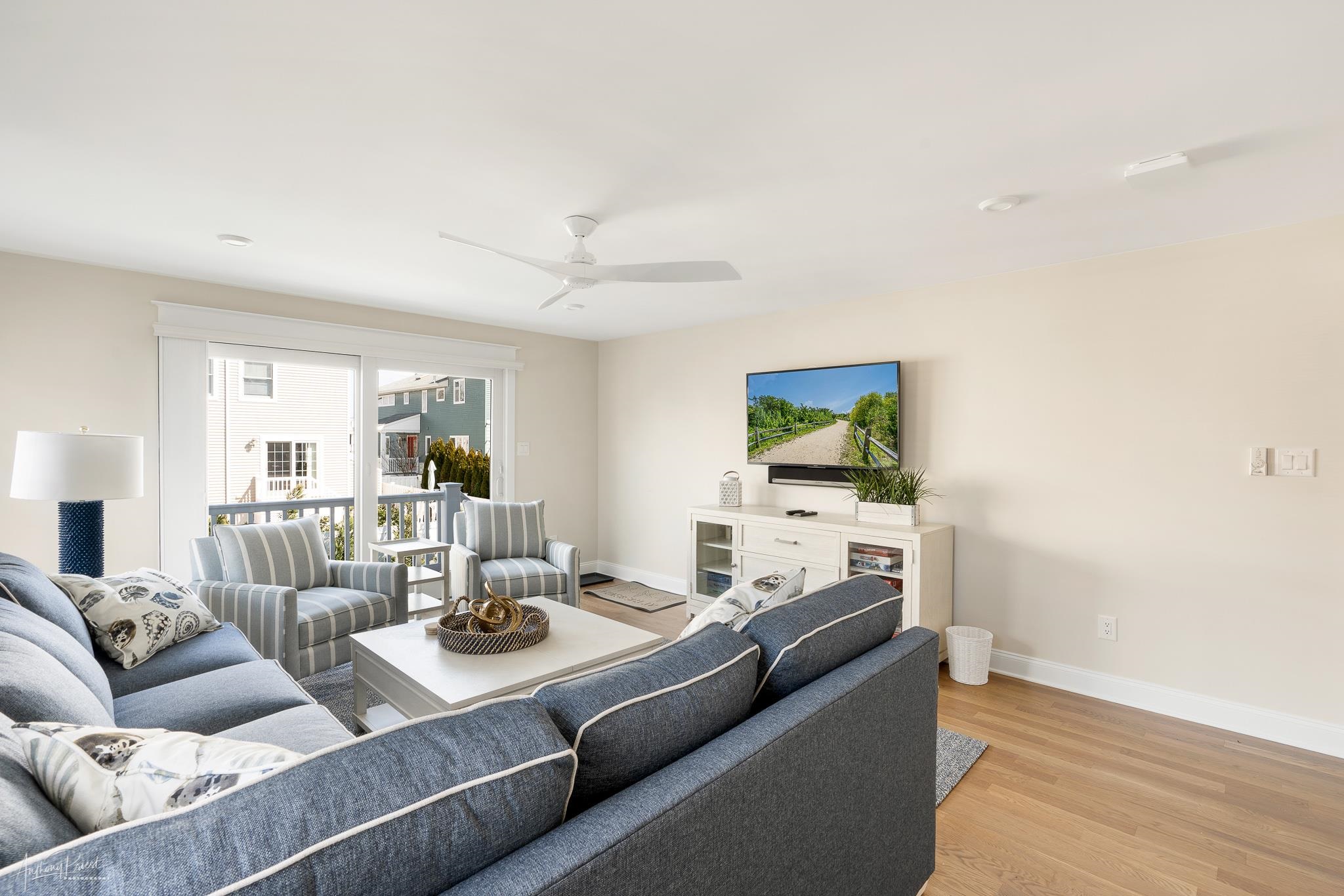 169 27th Street Avalon, NJ 08202 - Photo 11 of 32 a living room with furniture and a flat screen tv