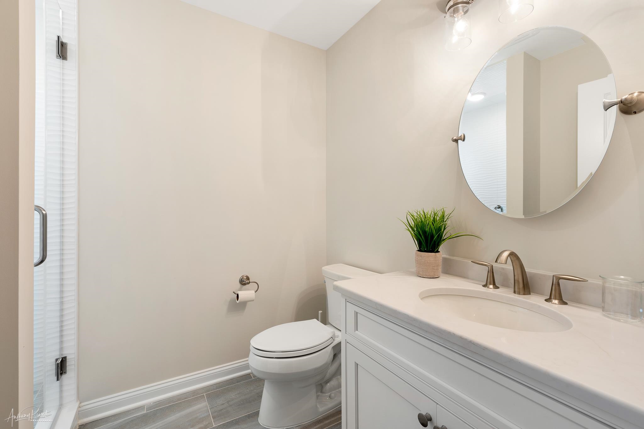 169 27th Street Avalon, NJ 08202 - Photo 17 of 32 a bathroom with a granite countertop sink mirror and toilet