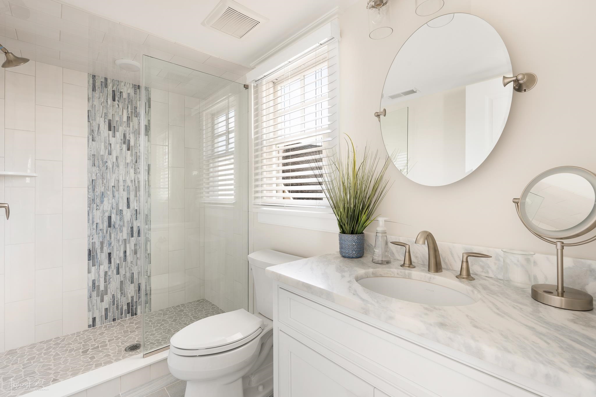 169 27th Street Avalon, NJ 08202 - Photo 19 of 32 a bathroom with a toilet sink and mirror