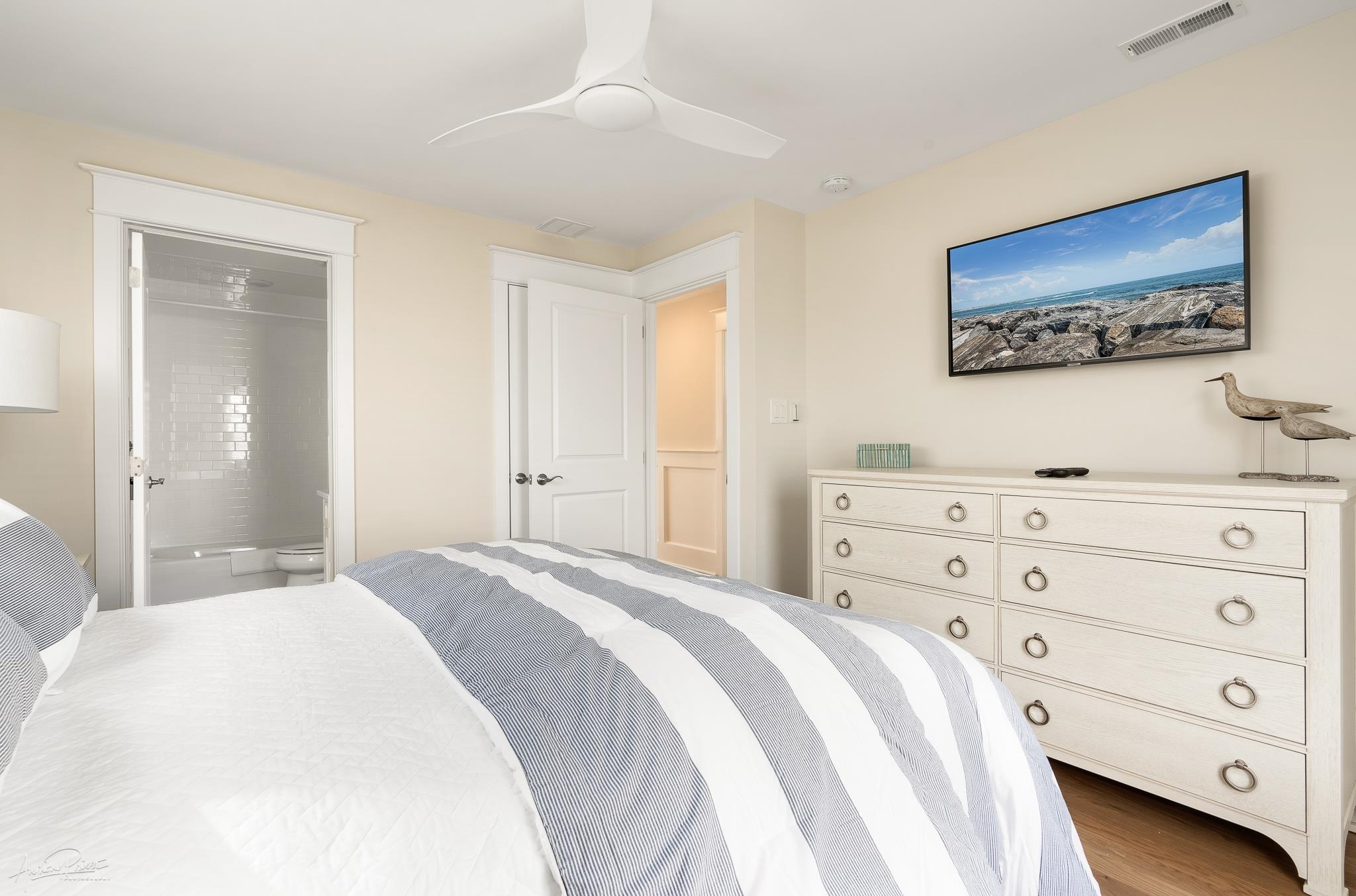 169 27th Street Avalon, NJ 08202 - Photo 20 of 32 a bedroom with a bed and a dresser