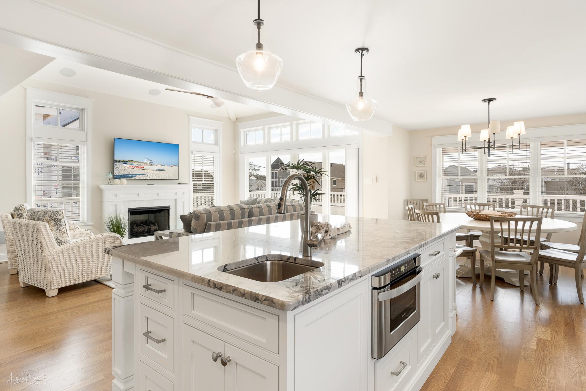 169 27th Street Avalon, NJ 08202 - Photo 2 of 32 a kitchen with stove and chairs