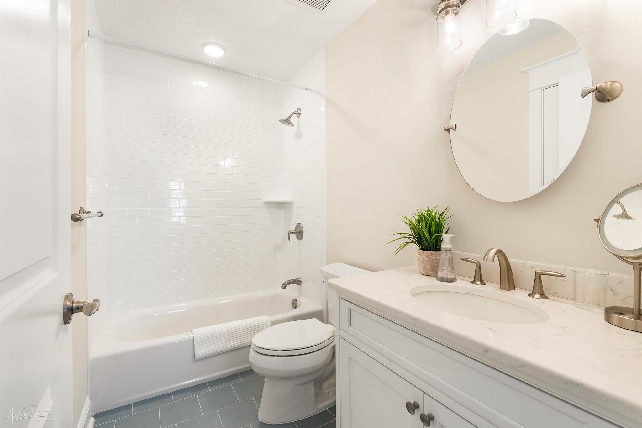 169 27th Street Avalon, NJ 08202 - Photo 22 of 32 a bathroom with a granite countertop sink a toilet and shower