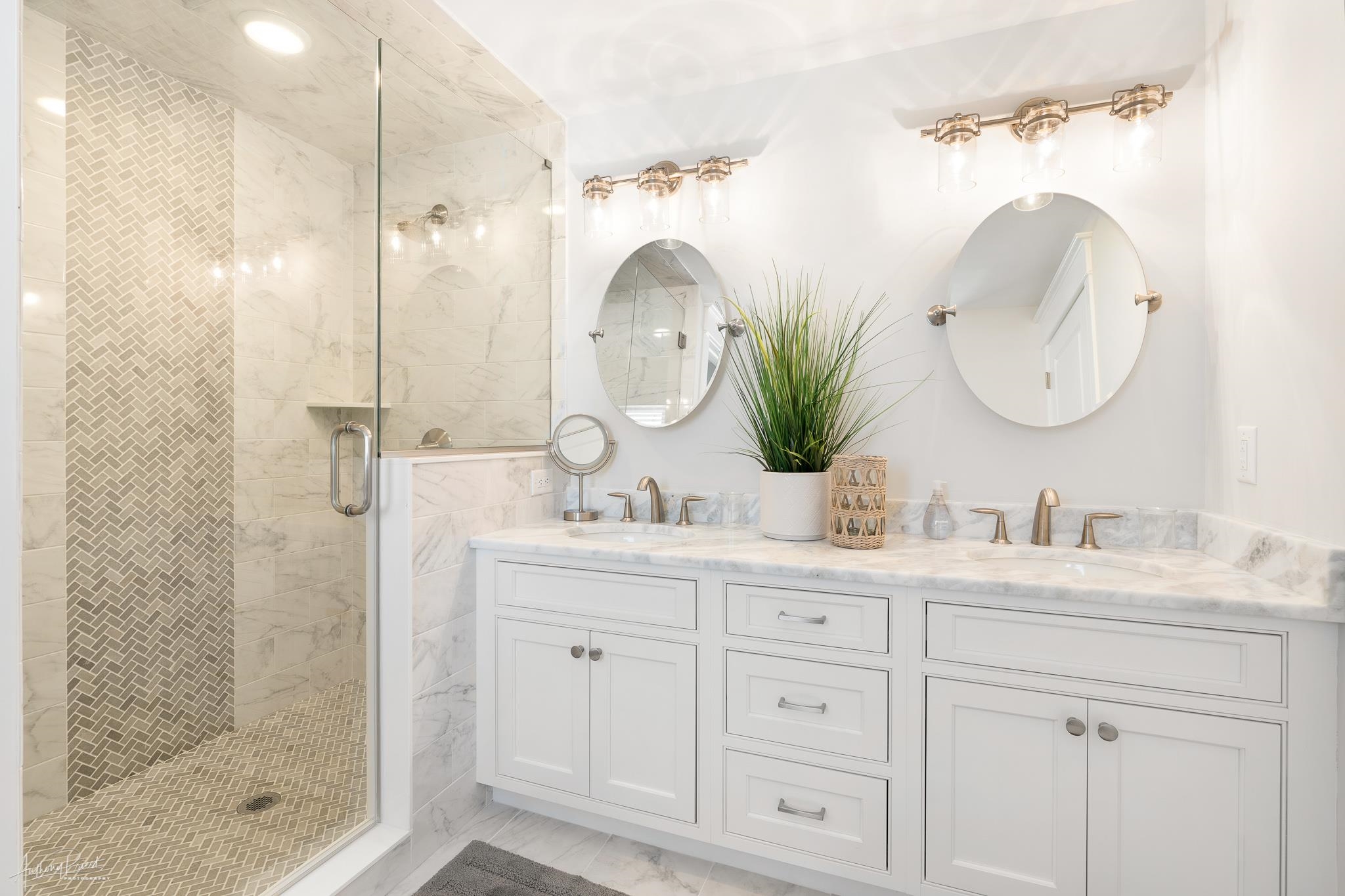 169 27th Street Avalon, NJ 08202 - Photo 26 of 32 a bathroom with a double vanity sink mirror and shower