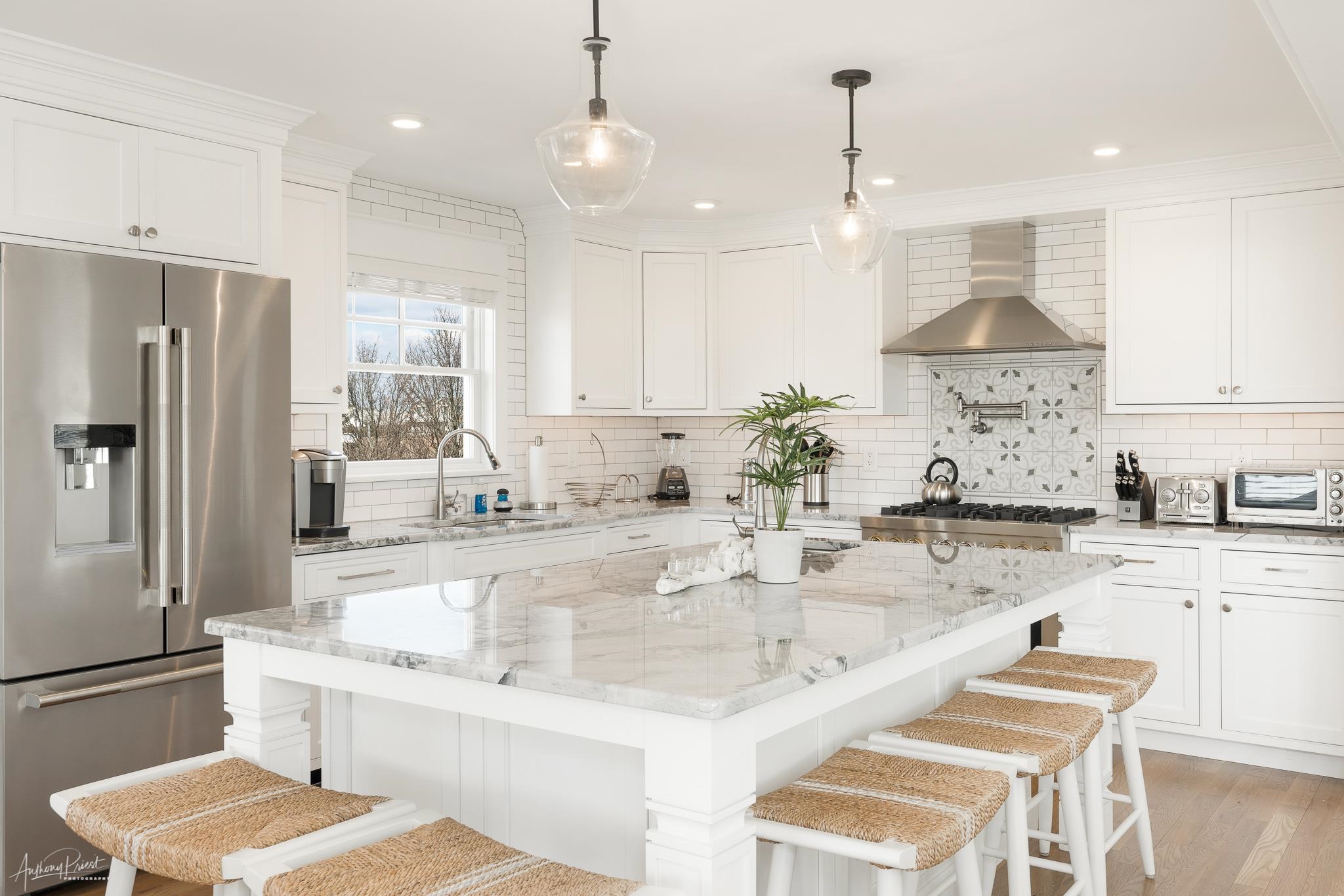169 27th Street Avalon, NJ 08202 - Photo 3 of 32 a kitchen with stainless steel appliances kitchen island granite countertop a sink and refrigerator