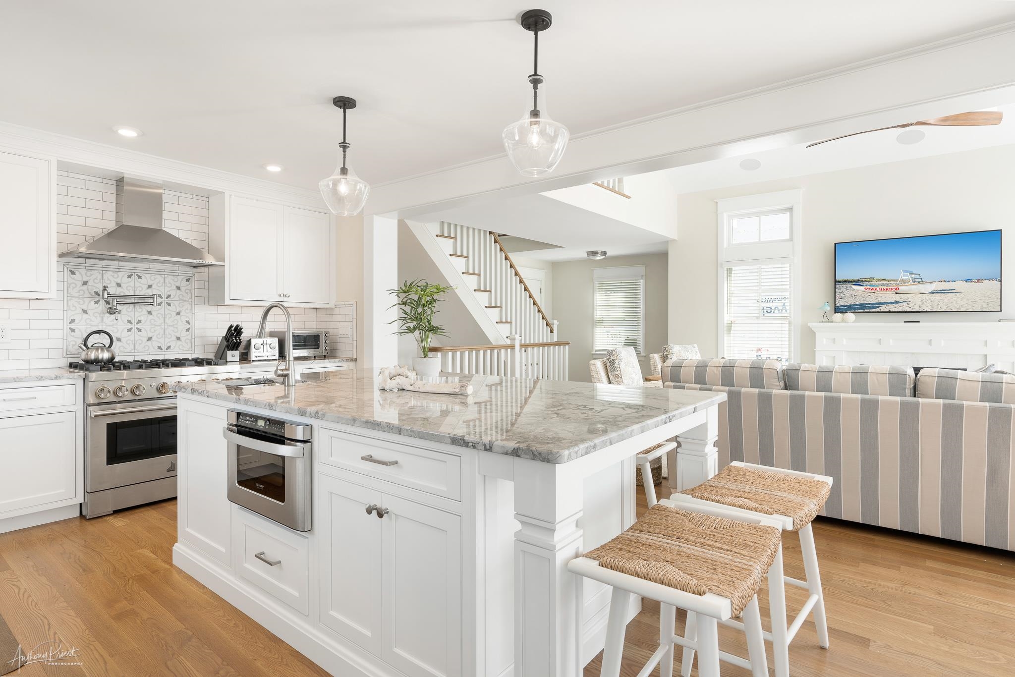 169 27th Street Avalon, NJ 08202 - Photo 8 of 32 a kitchen with stainless steel appliances granite countertop a stove a sink and a refrigerator