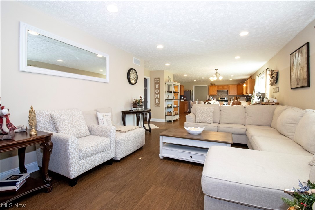 4750 McCauley Road Wooster, OH 44691 - Photo 13 of 37 Living room with dark style flooring and a textured ceiling