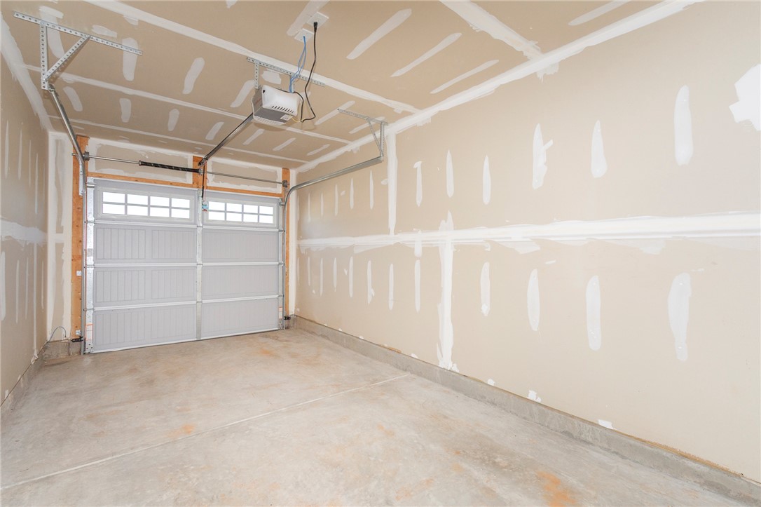 233 Scenic Road Anderson, SC 29621 - Photo 24 of 50 A spacious garage with a functional door opener and ample room for storage.