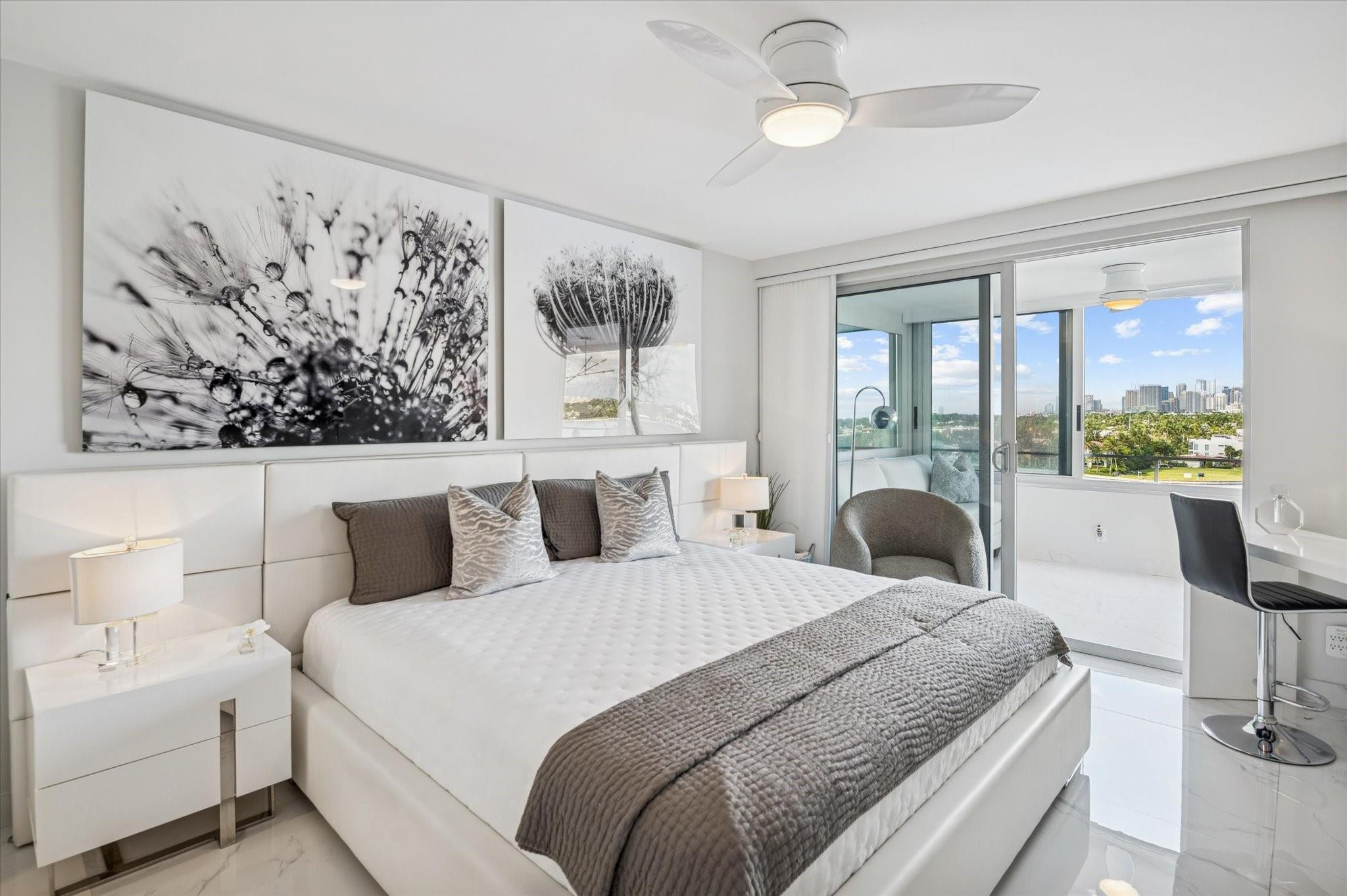 215 North Birch Road, Unit 8C Fort Lauderdale, FL 33304 - Photo 13 of 22 a bedroom with a bed and a large window with outer view