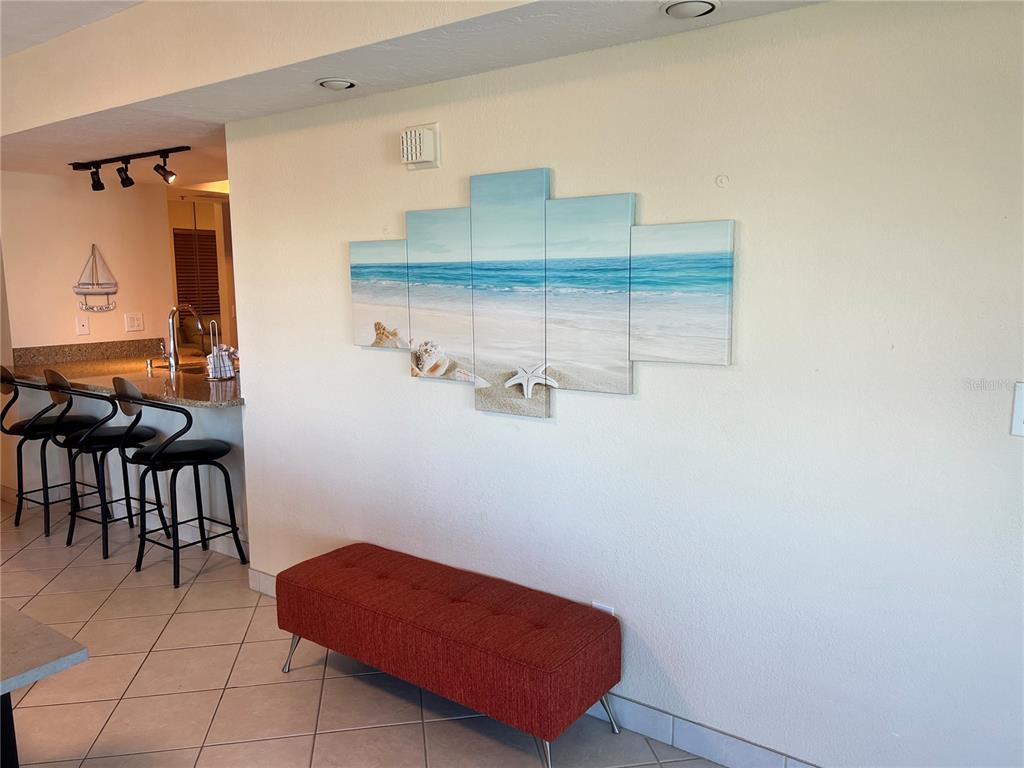 1001 Point Of Rocks Road, Unit 412 Sarasota, FL 34242 - Photo 11 of 43 a room with wooden floor and furniture