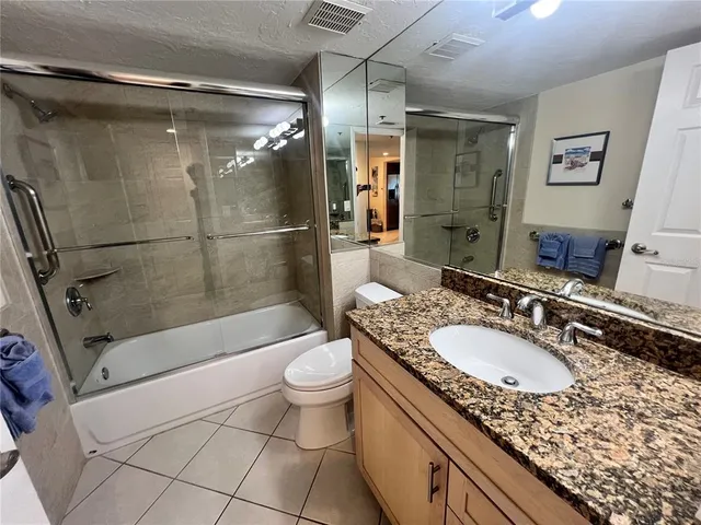 a room with mirror and window